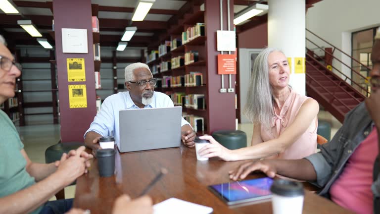 https://media.gettyimages.com/id/2194326884/video/coworkers-talking-on-a-business-meeting-on-a-library.jpg?b=1&s=640x640&k=20&c=_xHfiojwvsPDpmYZ5-FO1xzKSD2RpNk0_6GBLcaD_u4=