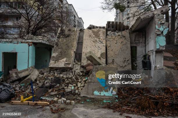 Picture remains on the wall of a kindergarten building that was damaged during the Russian invasion in Kharkiv's Saltivka district on January 20,...