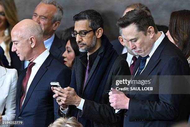 Amazon founder Jeff Bezos, Google CEO Sundar Pichai, and Tesla and SpaceX CEO Elon Musk attend the inauguration ceremony before Donald Trump is sworn...