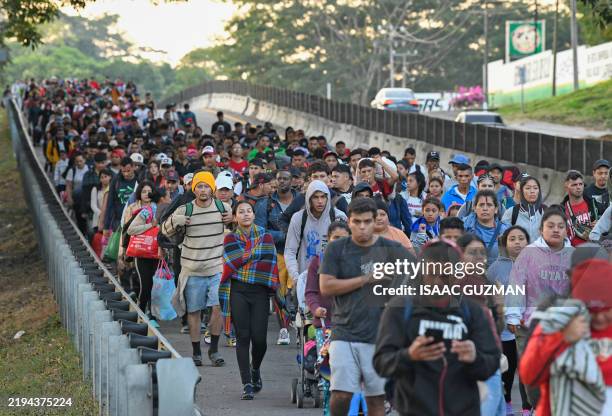 Migrants from a caravan in Tapachula, Chiapas state, Mexico, march while heading to the US border on January 20, 2025. US President Donald Trump was...
