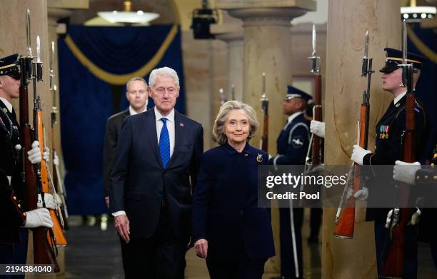 Former President Bill Clinton and former US Secretary of State Hillary Clinton arrive prior to the inauguration of President-elect Donald Trump at...