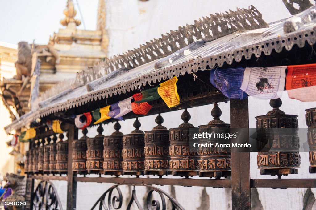 Prayer mills in a row at Swayambhunath Stupa
