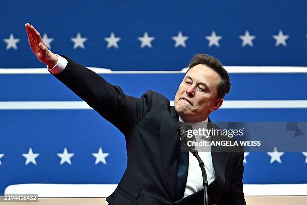 Tesla and SpaceX CEO Elon Musk gestures as he speaks during the inaugural parade inside Capitol One Arena, in Washington, DC, on January 20, 2025.