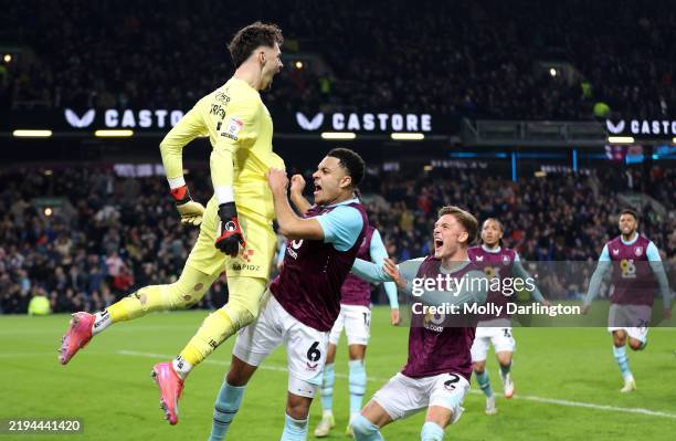 James Trafford of Burnley celebrates with his teammates after saving a second penalty from Wilson Isidor of Sunderland during the Sky Bet...