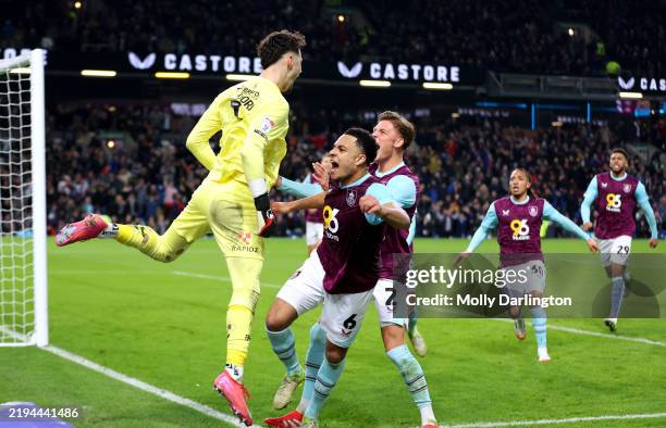 James Trafford of Burnley celebrates with his teammates after saving a second penalty from Wilson Isidor of Sunderland during the Sky Bet...