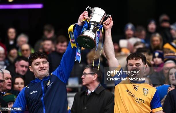 Dublin , Ireland - 19 January 2025; Na Fianna players Tom Gleeson, left, and Conor Kelly lifts the Tommy Moore Cup after their side's victory in the...