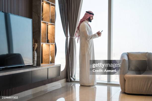 focused arab businessman with riyadh skyline view - saudi arabia people stock pictures, royalty-free photos & images
