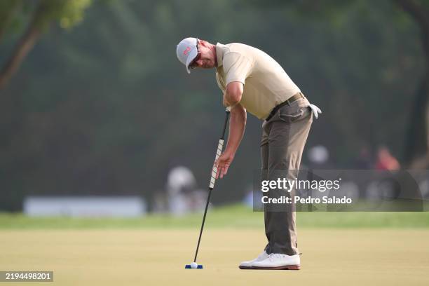 Adam Scott of Australia plays a putt on the 6th hole during the third round of the Hero Dubai Desert Classic at Emirates Golf Club on January 18,...