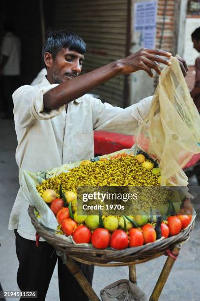 a vendor were displaying the traditional indian food on the street. - maharashtra stock pictures, royalty-free photos & images
