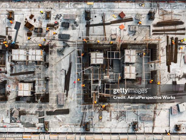 drone point view of workers working on construction site / hangzhou, china - construction frame stock pictures, royalty-free photos & images