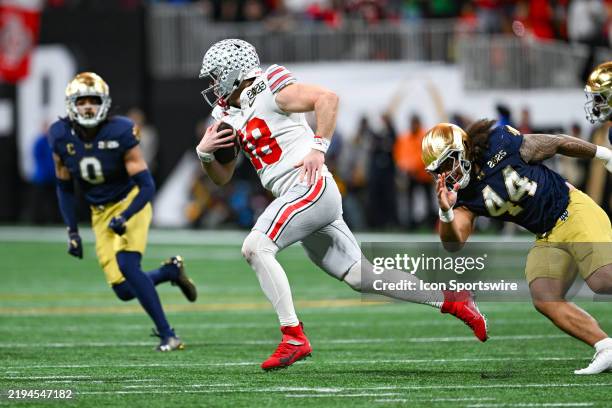 Quarterback Will Howard of the Ohio State Buckeyes runs the ball during the Ohio State Buckeyes versus Notre Dame Fighting Irish College Football...