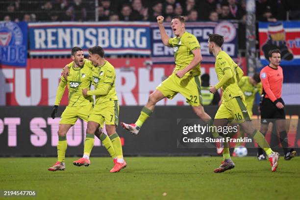 Andrej Kramaric of TSG 1899 Hoffenheim celebrates the team's second goal with teammates during the Bundesliga match between Holstein Kiel and TSG...