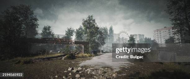 abandoned pripyat amusement park and buildings with overgrown vegetation - eroded stock pictures, royalty-free photos & images