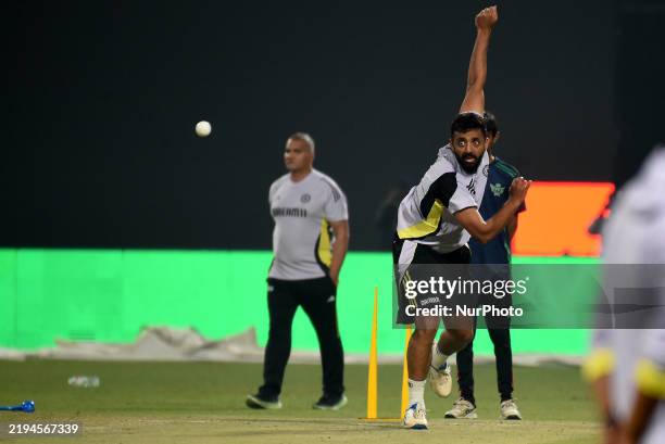 India's Varun Chakravarthy delivers a ball during a practice session ahead of their first Twenty20 international cricket match against England at the...