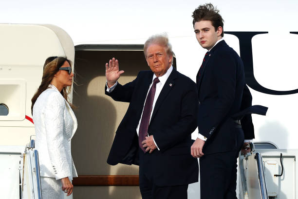 President-elect Donald Trump, Melania Trump and their son Barron board a U.S. Air Force aircraft en route to Dulles, Virginia on January 18, 2025 in...