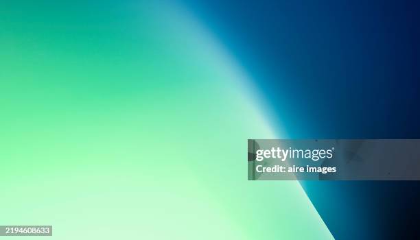 abstract background blending green and blue colors with light effect - turkoois stockfoto's en -beelden