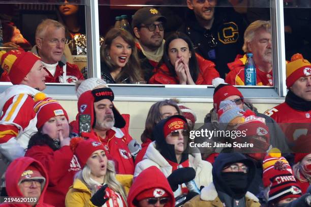 Singer-songwriter Taylor Swift talks with Caitlin Clark of the Indiana Fever during the second half in the AFC Divisional Playoff between the Houston...