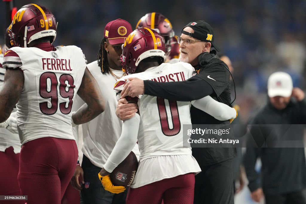 Mike Commanders Mike Sainristil of the Washington Commanders celebrates with Head ...