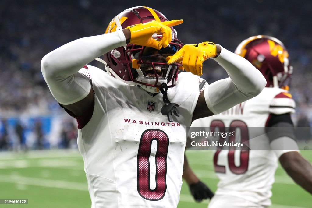 Mike Commanders Mike Sainristil of the Washington Commanders celebrates after an ...