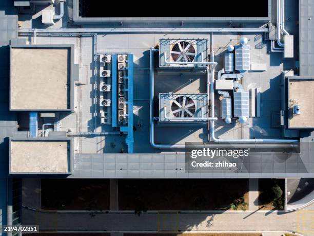 heater air conditioner overlooking the roof of the building - klimatechnik stock-fotos und bilder