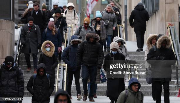 Commuters walk to Union Station as Toronto experiences it's coldest day of the winter as a polar vortex covers most of North America in Toronto....