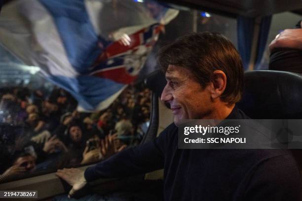 Napoli Head Coach Antonio Conte inside the team bus watching the supporters outside the Capodichino Airport after the Serie A match victory in...