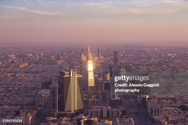 shimmering sunset over riyadh’s skyline - riyadh stock pictures, royalty-free photos & images