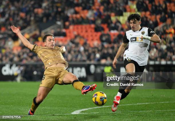 Aritz Elustondo of Real Sociedad stretches for the ball ahead of Diego Lopez of Valencia CF during the LaLiga match between Valencia CF and Real...