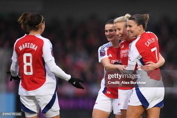 BOREHAMWOOD, ENGLAND Leah Williamson of Arsenal celebrates with teammates Emily Fox, Mariona Caldentey and Steph Catley after scoring her team's...