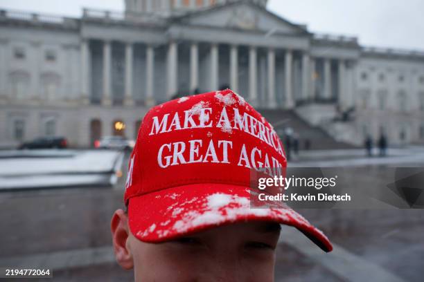 Trump supporter JT Whitaker from Gunnersville, Alabama wears a Make America Great Again hat in the snow on January 19, 2025 in Washington, DC. U.S....