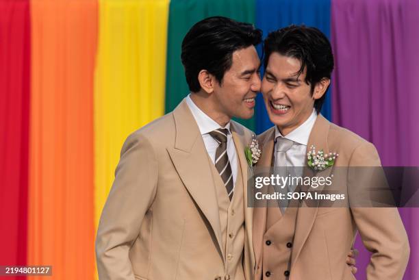 Thai LGBT couple, Thai actors, Apiwat Apiwatsayree and Sappanyoo Panatkool seen pose for a photo after registering their same-sex marriage at the...