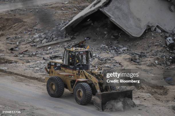 Bulldozer clears rubble from a road for humanitarian aid trucks to pass, in Rafah, Gaza, on Wednesday, Jan. 22, 2025. The ceasefire agreement...