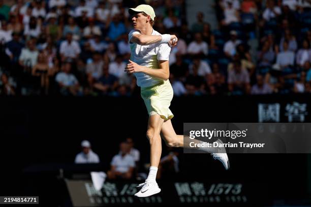 Jannik Sinner of Italy plays a forehand against Holger Rune of Denmark in the Men's Singles Fourth Round match during day nine of the 2025 Australian...