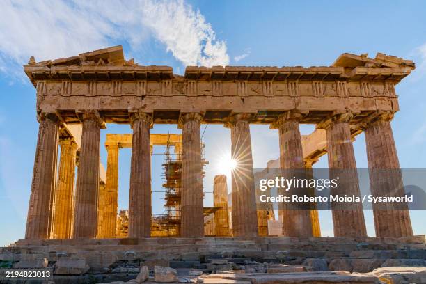 columns of the parthenon lit by sun rays, acropolis - ancient greece stock pictures, royalty-free photos & images