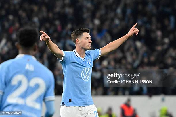 Malmoe's Norwegian midfielder Lasse Berg Johnsen celebrates scoring his team's first goal during the UEFA Europa League football match between Malmoe...