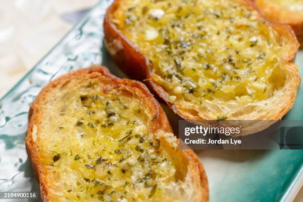 close-up view of the herb garlic bread - garlic bread stock pictures, royalty-free photos & images