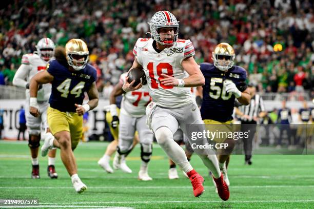 Will Howard of the Ohio State Buckeyes runs the ball during the first half of the 2025 CFP National Championship Game against the Notre Dame Fighting...