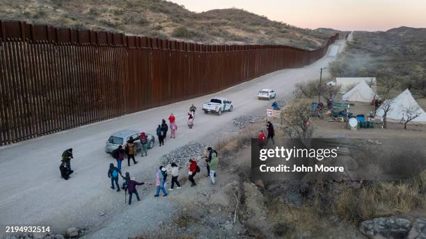 Immigrants prepare to be transported by U.S. Border Patrol agents after crossing the U.S.-Mexico border on January 20, 2025 near Sasabe, Arizona....