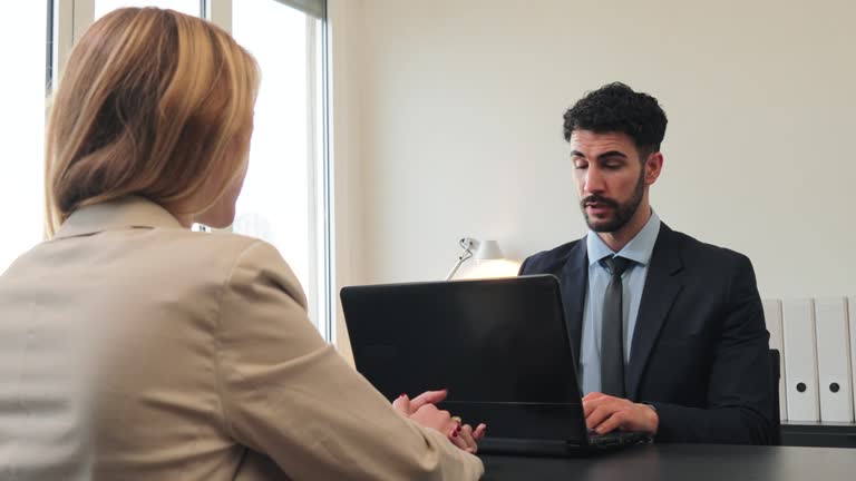 https://media.gettyimages.com/id/2194981748/video/a-human-resources-manager-man-is-conducting-a-job-interview-with-a-new-employee-a-salesperson.jpg?b=1&s=640x640&k=20&c=PJ0-hoaWjnEv381RJAe2umE2c4m8nffhkrFY1DYbdCk=
