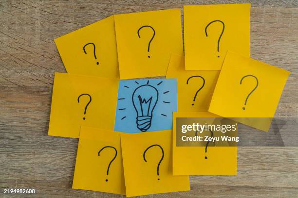 question marks and light bulb note brainstorming concept - fråga bildbanksfoton och bilder