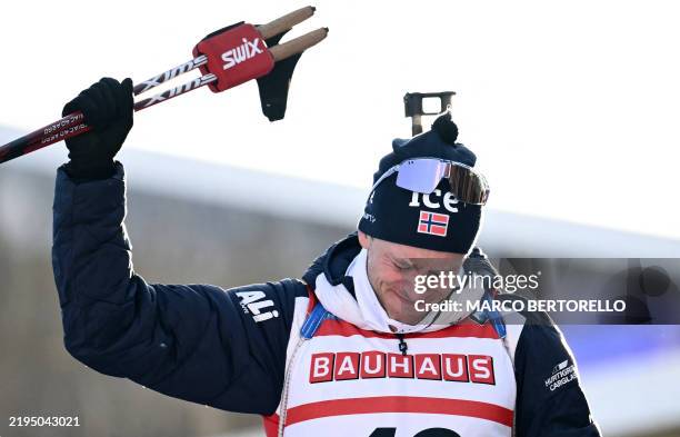 Norway's Tarjei Boe, winner, celebrates on the podium of the men's 10km sprint event of the IBU Biathlon World Cup in Antholz-Anterselva, Italy, on...