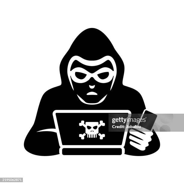 computer hacker over a laptop with card in hand - computer keyboard hands stock illustrations