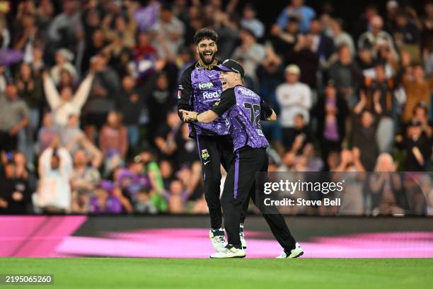 Nathan Ellis and Nikhil Chaudhary of the Hurricanes celebrate the win during the BBL Qualifier match between the Hobart Hurricanes and Sydney Sixers...