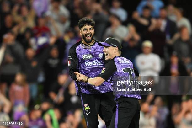 Nathan Ellis and Nikhil Chaudhary of the Hurricanes celebrate the win during the BBL Qualifier match between the Hobart Hurricanes and Sydney Sixers...
