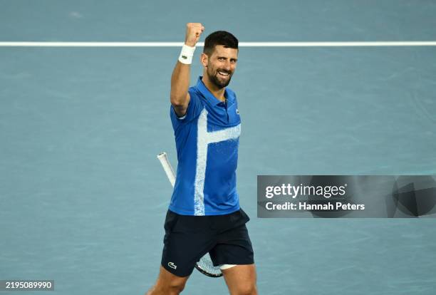 Novak Djokovic of Serbia celebrates winning match point against Carlos Alcaraz of Spain in the Men's Singles Quarterfinal match during day 10 of the...