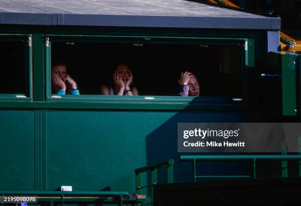 Tense looking tennis fans look on during the Men's Third Round match between Tim Henman of Great Britain and Wayne Ferreira of South Africa at the...