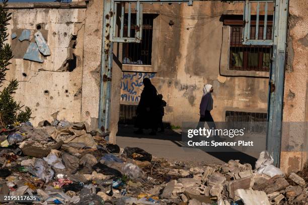 Buildings stand destroyed in a neighborhood heavily damaged in during years of fighting in the city of Homs on January 21, 2025 in Homs, Syria. Homs,...