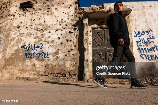 Buildings stand destroyed in a neighborhood heavily damaged in during years of fighting in the city of Homs on January 21, 2025 in Homs, Syria. Homs,...