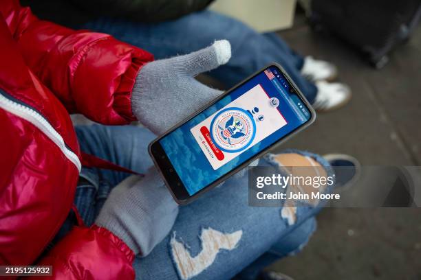 Immigrant from Venezuela tries in vain to access the CBP One app day a day after the second inauguration of U.S. President Donald Trump on January...