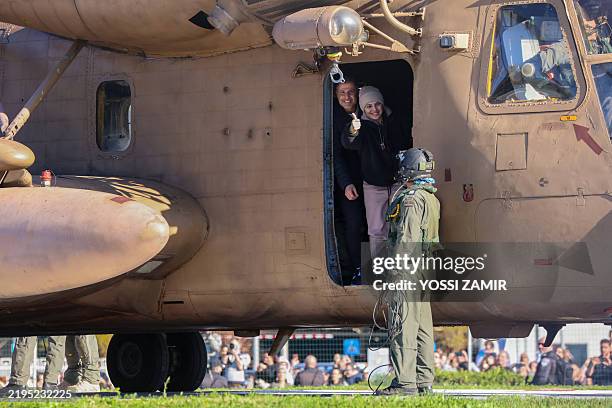 Newly released Israeli hostage Daniella Gilboa, gestures as she leaves a military helicopter upon landing at the Beilinson Hospital in Petah Tikva on...